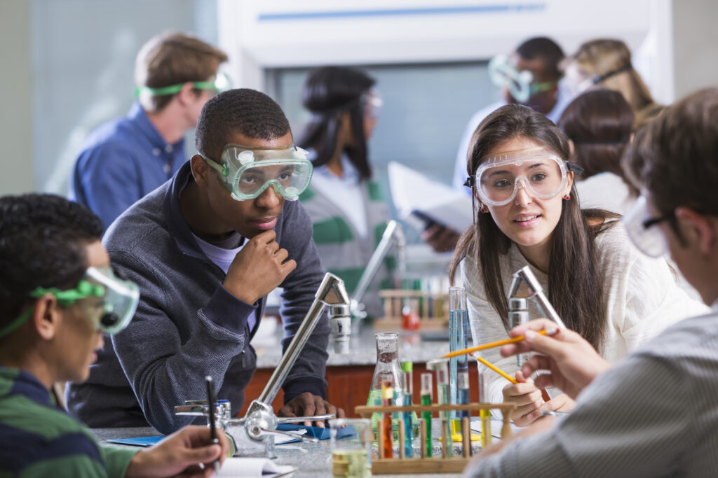 a group of youths conducting an experiment during a STEM lab